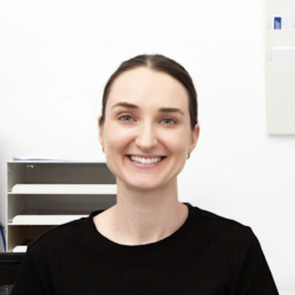 Dr Carly Cook smiling in a black t-shirt